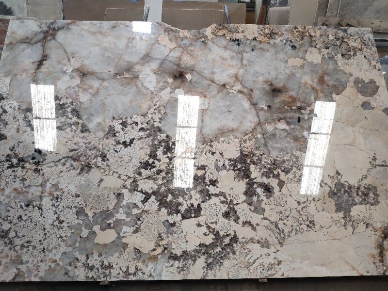 Workers fabricating quartzite slabs